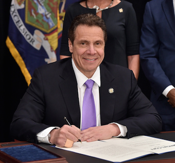 New York Gov. Andrew Cuomo signs legislation designed to increase the statewide minimum wage to $15.