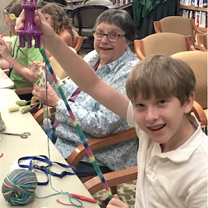 Residents of Presbyterian Village North recently taught some area children how to knit.