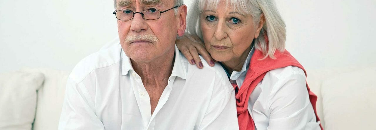 Worried older couple