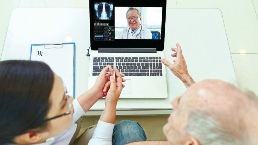 resident looking at doctor on computer screen