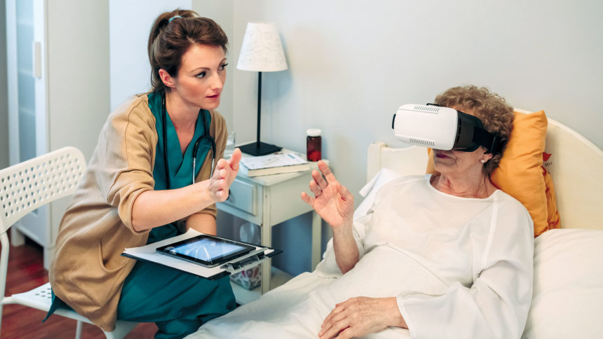 Healthcare worker using virtual reality with senior