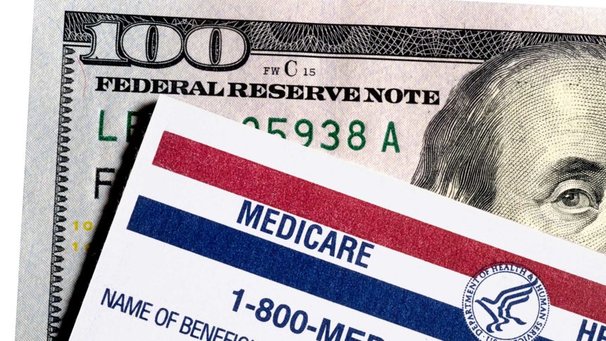 Medicare card on top of $100 bill