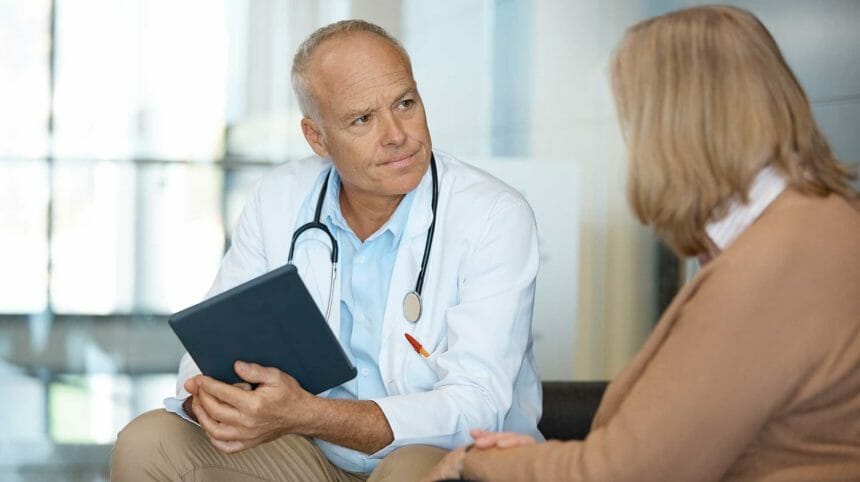 male doctor talking with woman