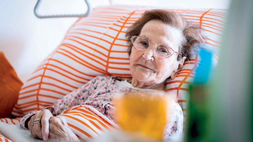 woman in nursing home bed