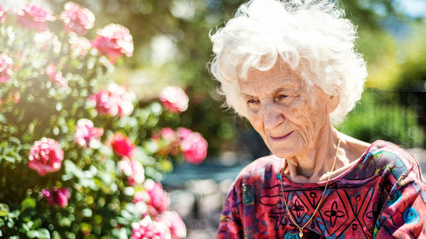 older woman in a garden