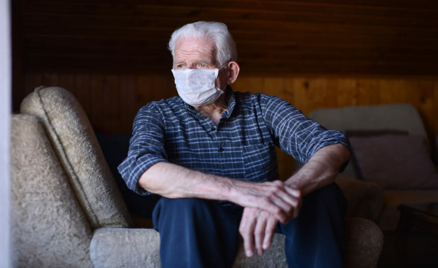 Portrait of older man wearing mask