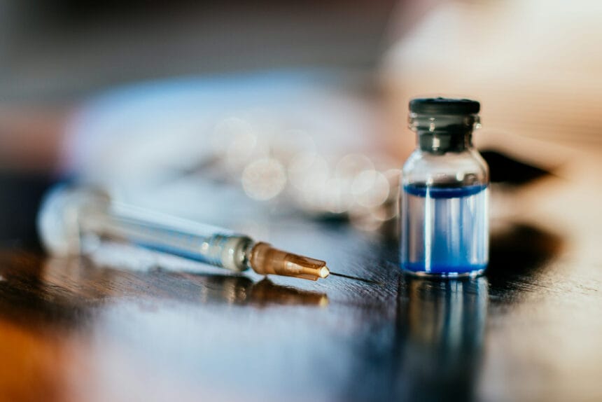 Syringe and a vial on a table