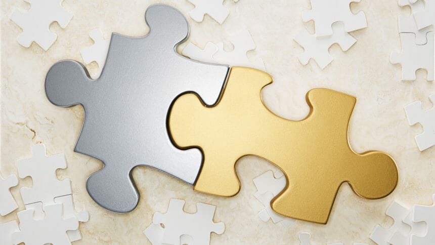 Gold and silver puzzle pieces