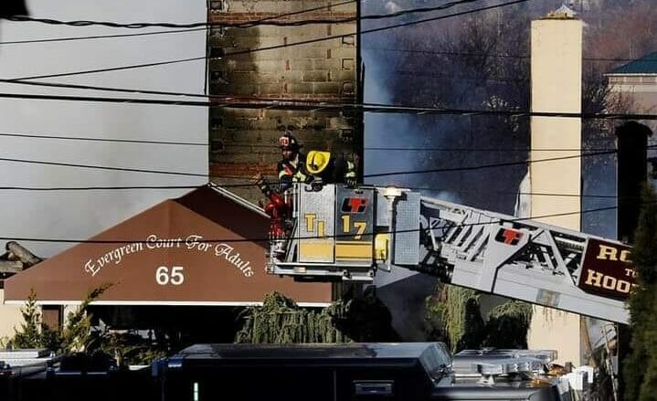 Massive NY assisted living blaze kills resident; firefighter still missing