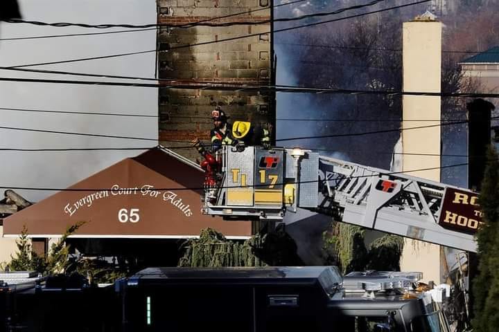Massive NY assisted living blaze kills resident; firefighter still missing