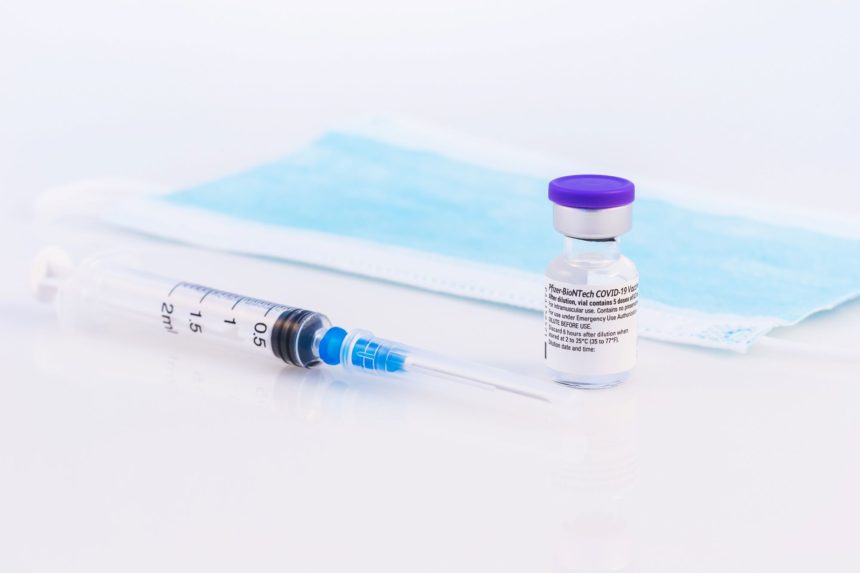 Pfizer vaccine vial and syringe