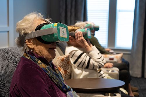 Older adults wearing virtual reality headsets
