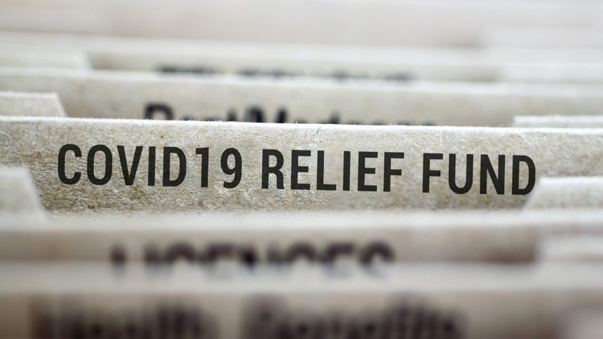 File folder labeled COVID-19 relief fund