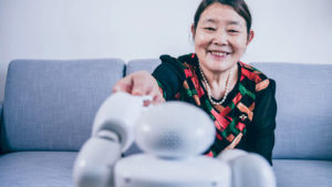 woman shaking hand with robot