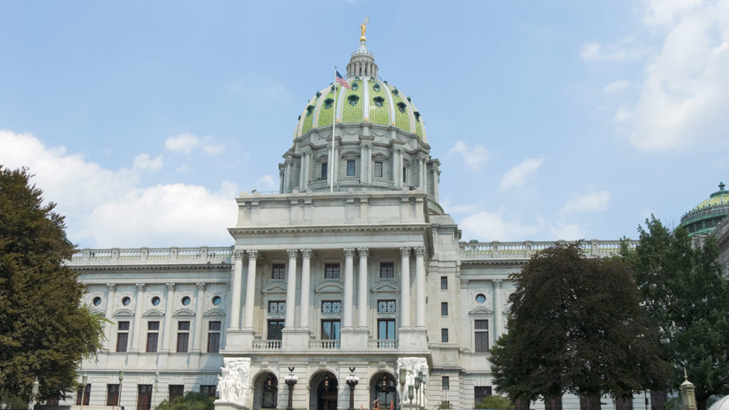 Pennsylvania state capitol government building in Harrisburg, PA, USA, front view in sunlight.