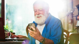 older man using smartphone