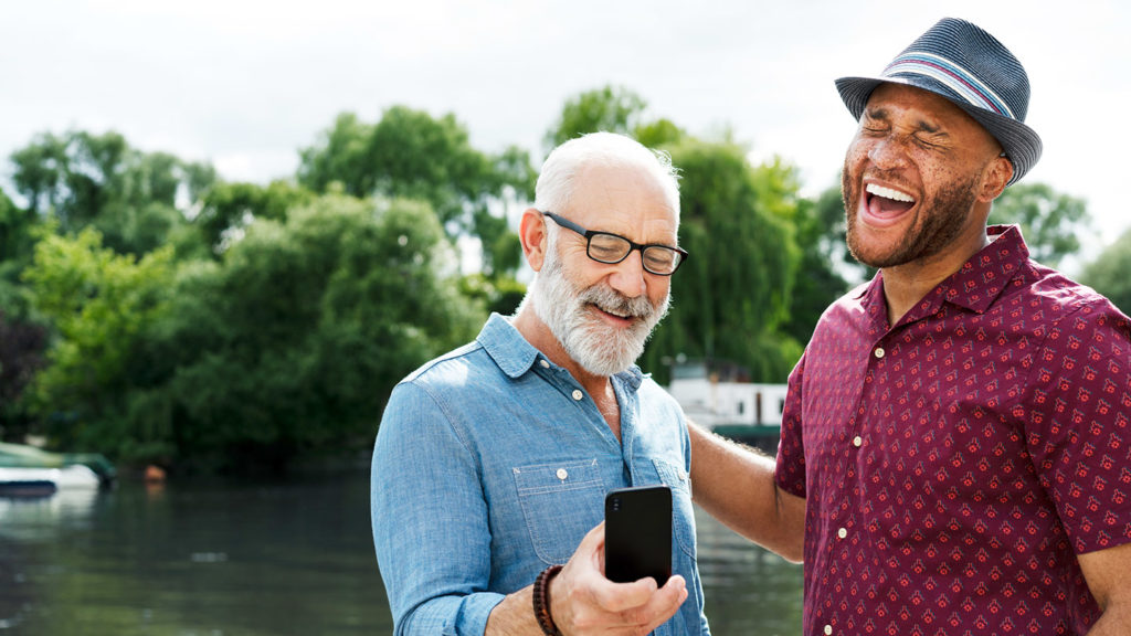 Two men laughing with smart phone