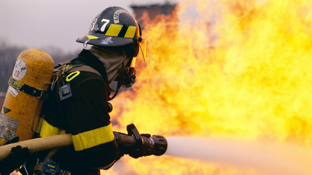Firefighter Battling Flame