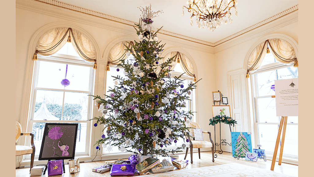 Christmas tree decorated with purple decorations in honor of those with Alzheimer's disease and their caregivers.