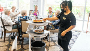 Dining robot pilot project finds benefits for senior living employers, staff, residents