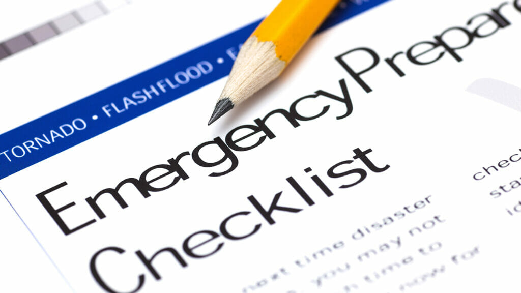 Emergency Preparedness Checklist with pencil. Close-up.