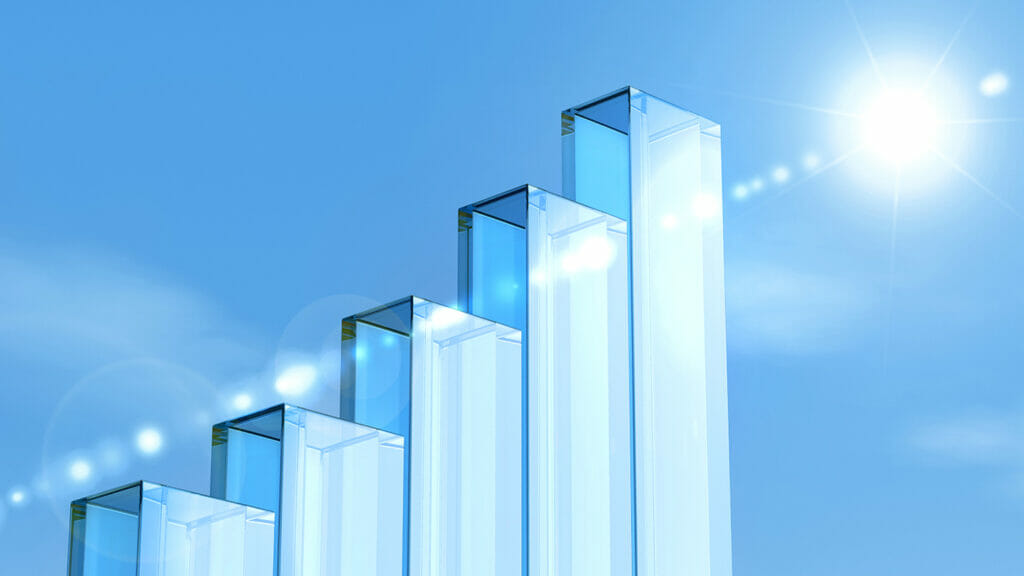 glass pillars forming a bar chart, blue sky and shining sun in the background