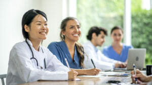 Group of medical students learn and listen in class.
