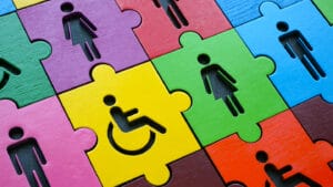 Diversity and inclusion. Multi-colored puzzle with figures of people.