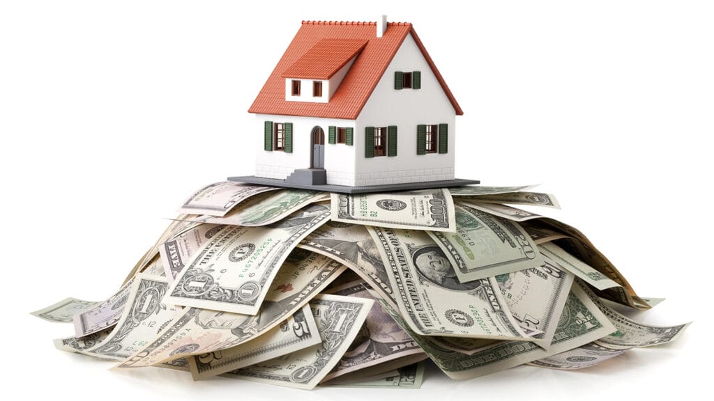 Miniature model house standing on a heap of dollar bills. Photo with clipping path.Some similar pictures from my portfolio:
