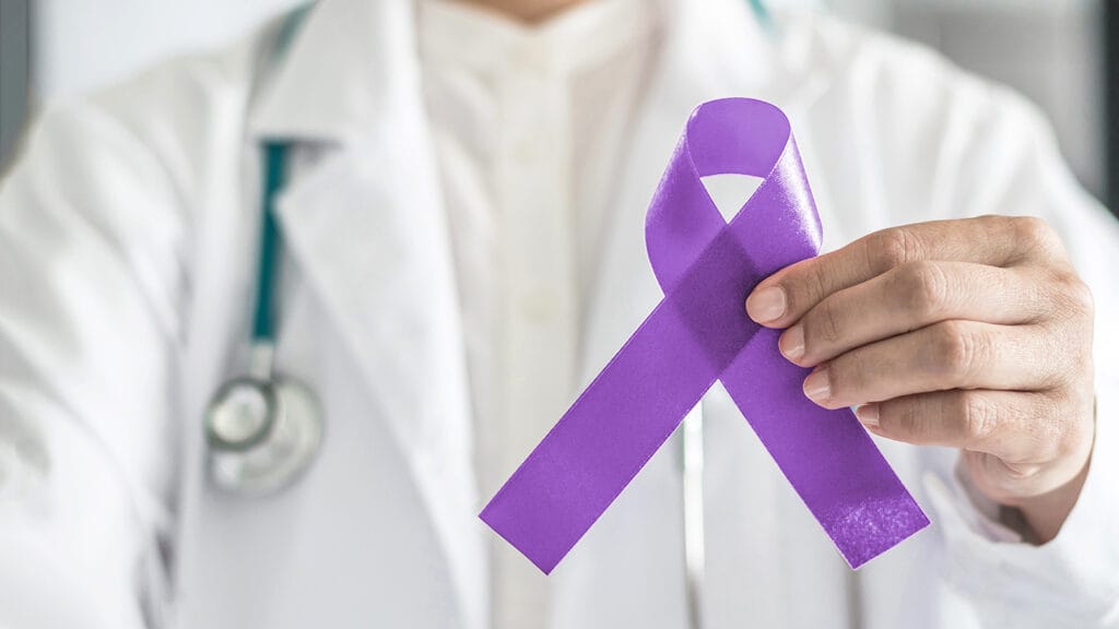 Orchid purple (lavender) ribbon awareness in doctorâs hand for (all kinds cancers), Testicular Cancer awareness, Craniosynostosis, Epilepsy, Hodgkin's lymphoma, National Cancer Prevention Month